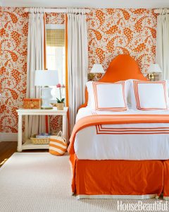 Quadrille orange and white wallpaper, bedroom