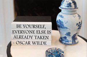 Humorous literary quote made through stack of decorative books.