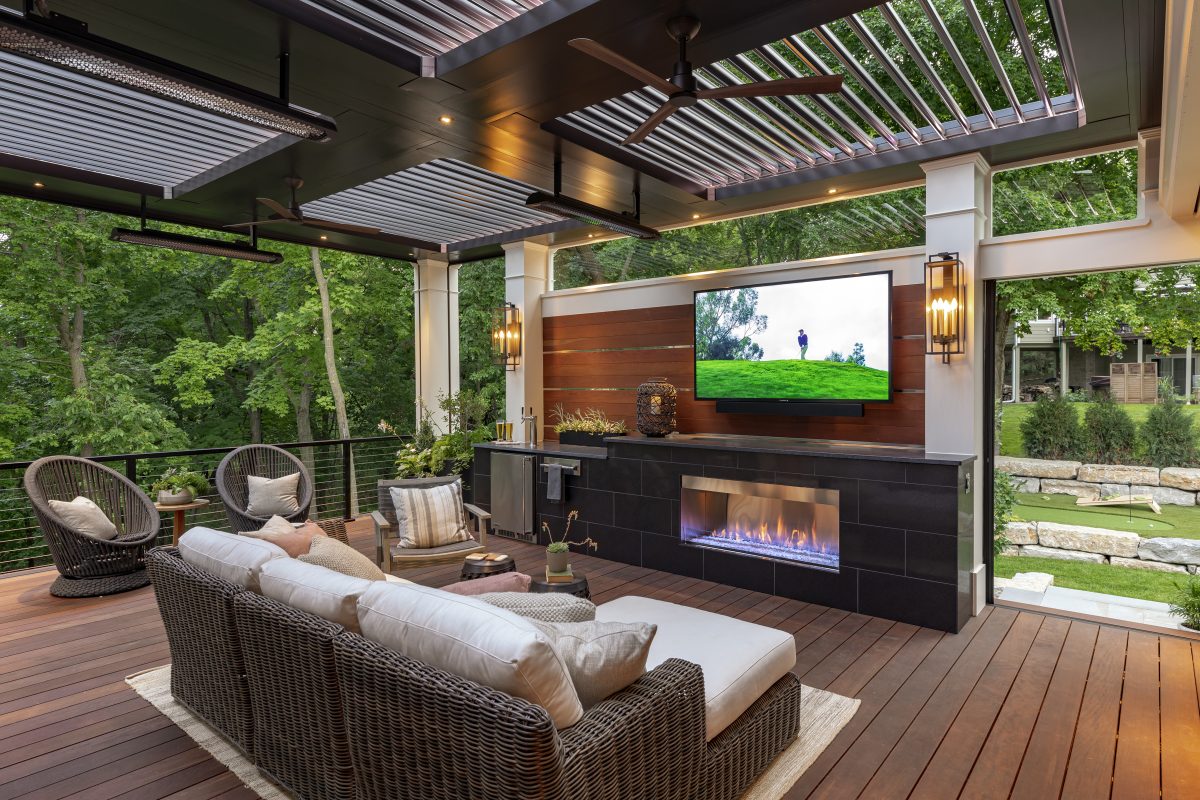 Outdoor theater under a pergola creates a staycation paradise.