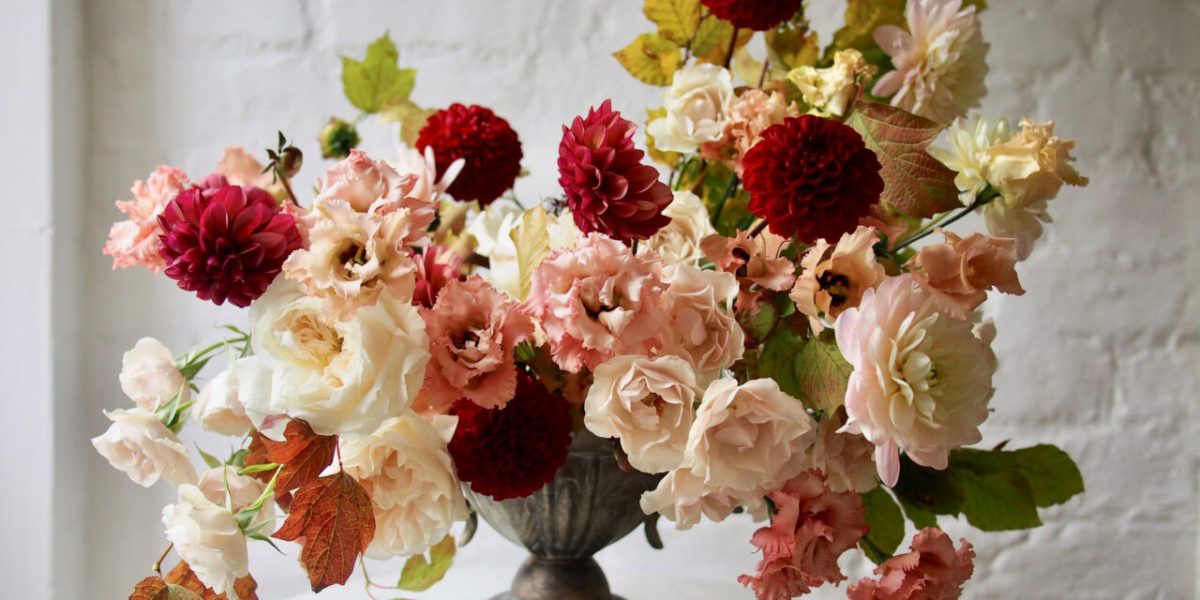 Warm tones, expanded monochrome color palettes, and lovely asymmetry are some key floral design trends for 2022.