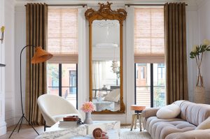 Layering different window treatment styles, colors and patterns is trending for 2022.
