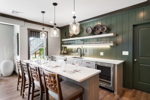 It’s impossible not to notice how well the chocolate trim around the door perfectly complements the courtyard green of the accent wall.