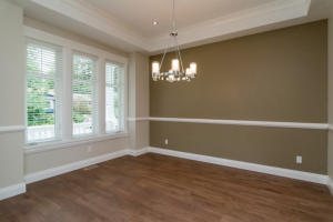 The molding added to this accent wall enhances the look of the baseboards and trim along the windows.