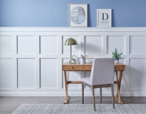 This accent wall is cut in half with an elevated chair rail.