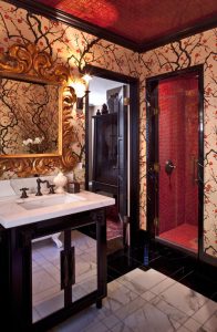 Beautiful dark crown molding makes an opulent bathroom statement.