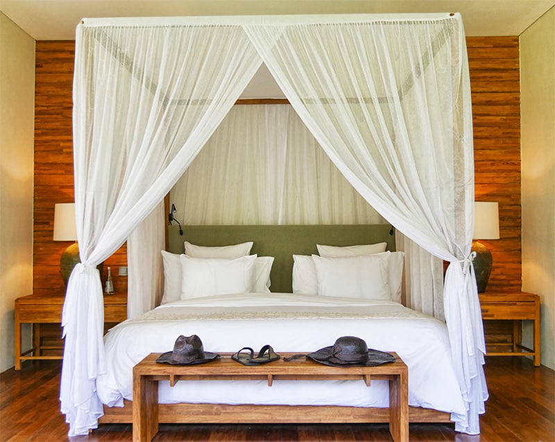 Canopy bed adds great sense of tropical style to a bedroom.
