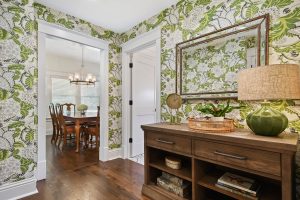 View of buffet with green wallpaper.