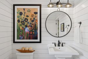 Framed art print brightening bathroom.