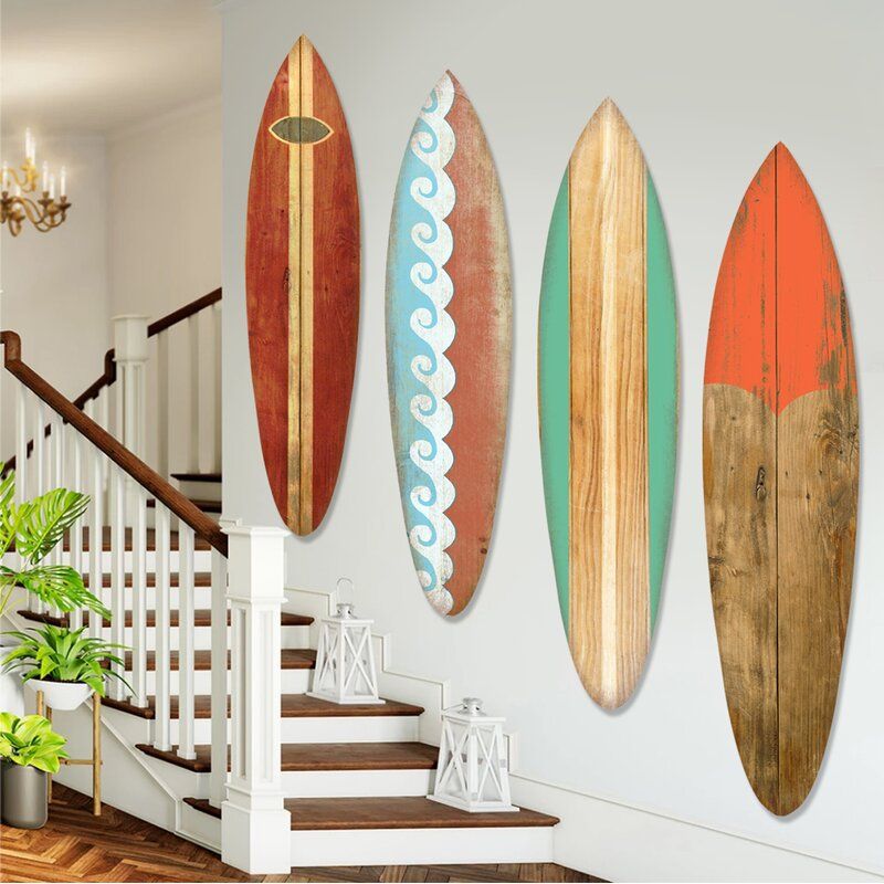 A colorful mix of a few surfboards create fun large decor.
