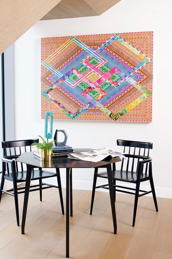 Bright, bold, geometric art is the focal point of the room.