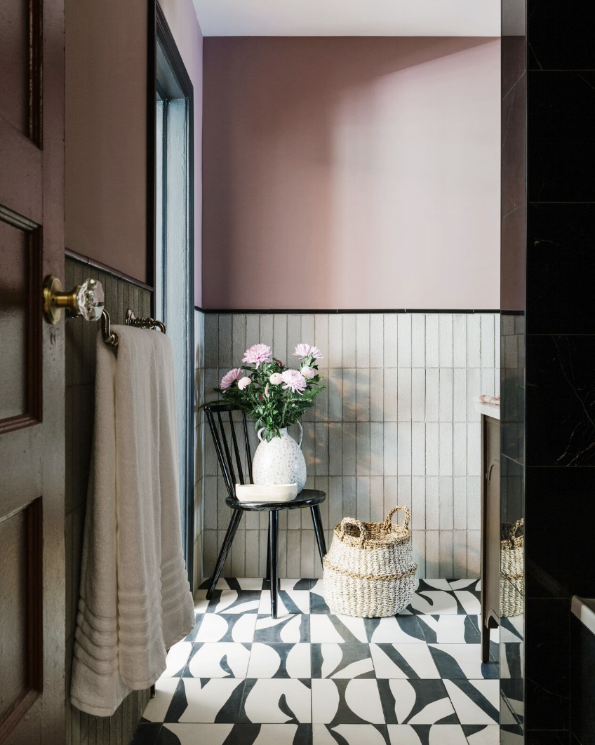 Wainscoting is chic again in 2023 bathroom designs.