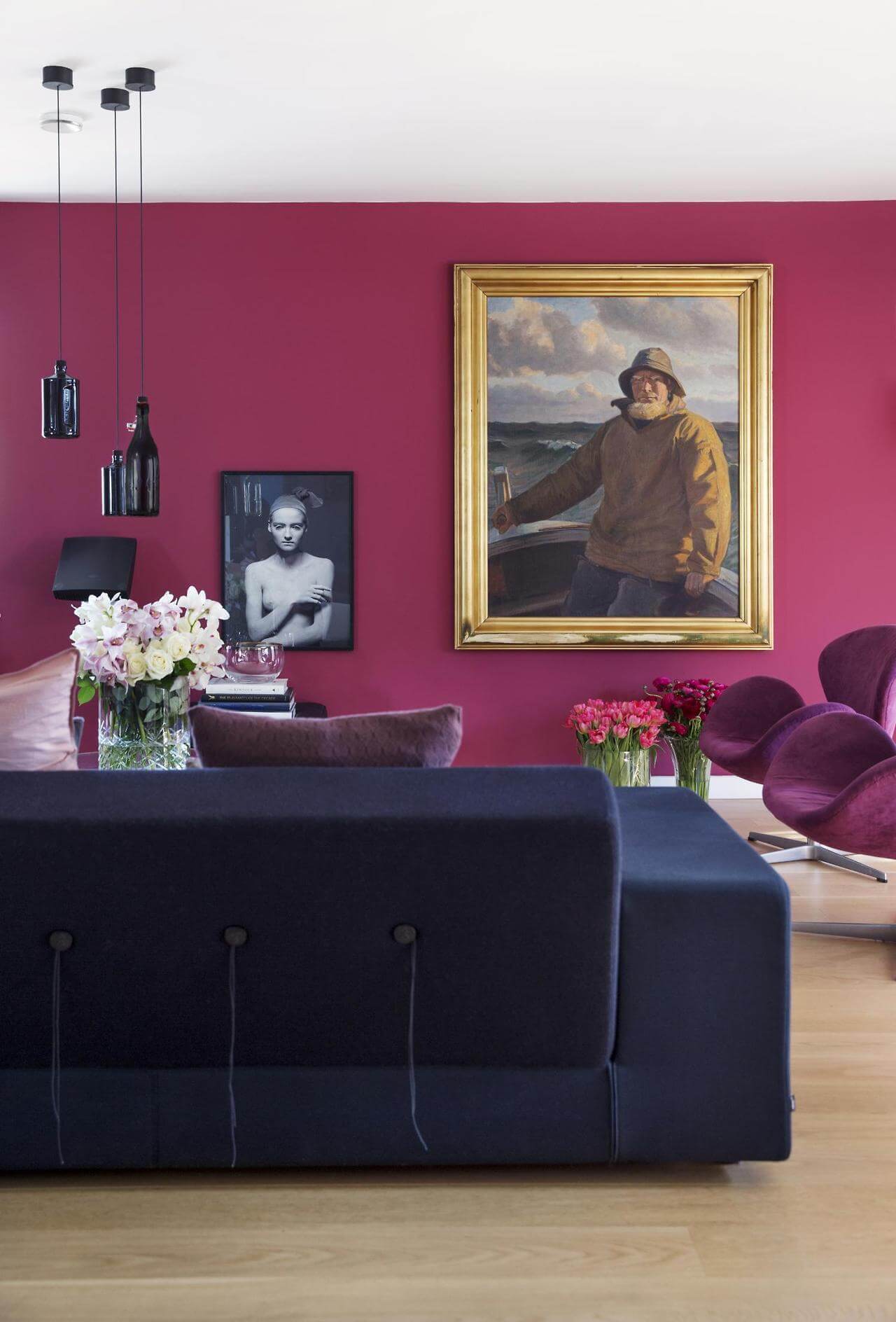 A Viva Magenta accent wall showcases artwork.