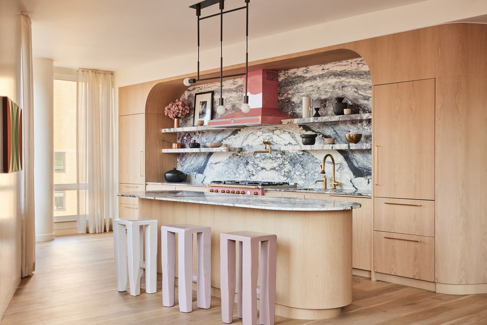 Statement stone backsplashes are a big 2023 kitchen trend.