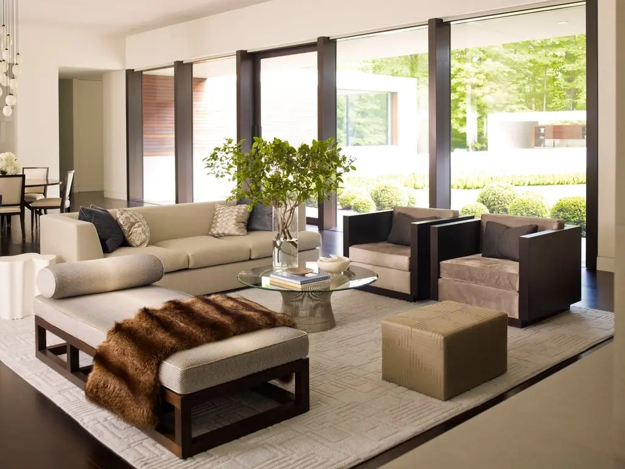 A custom-designed wool rug anchors a seating area in a modernist house in New Canaan, Conn.