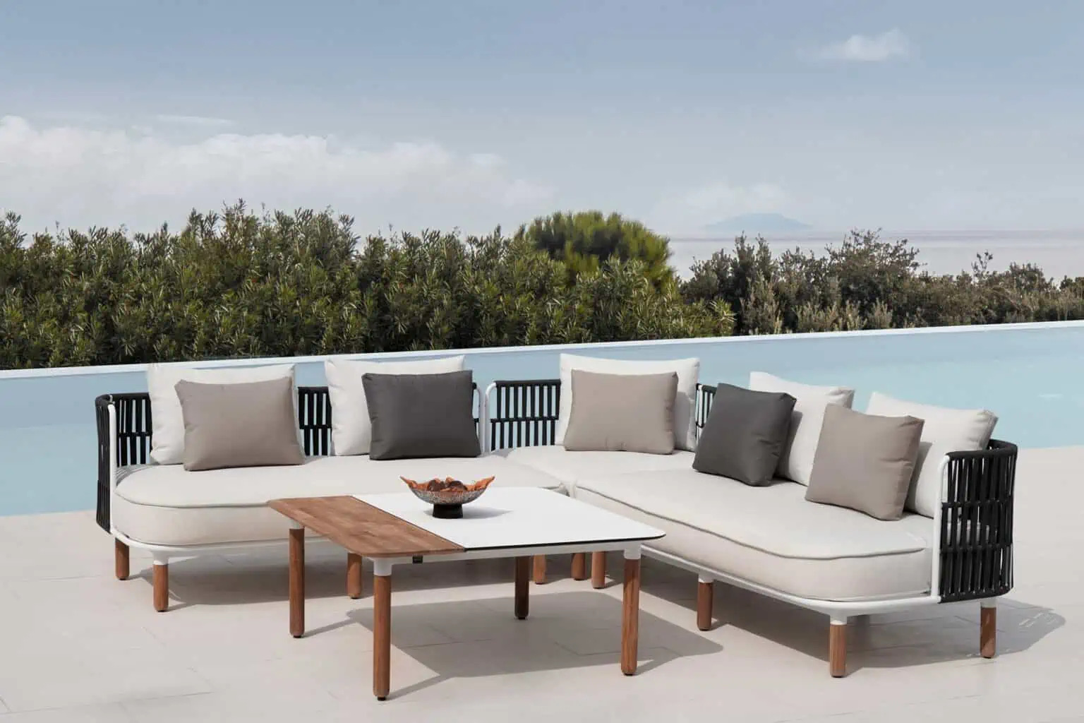 Outfitting your outdoor patio with mixed materials and collections is a great way to create a practical and stylish space