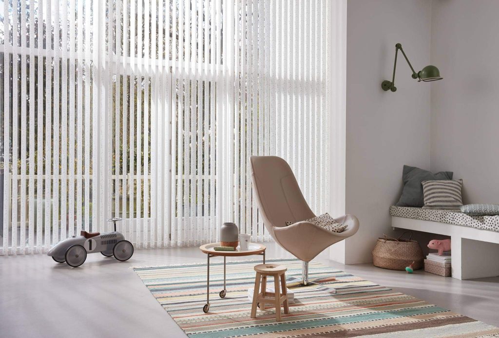 Pair vertical blinds with large and irregular windows.