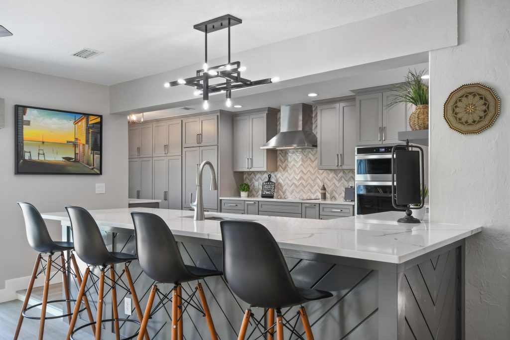 The remodeled/renovated kitchen area with countertop dining.