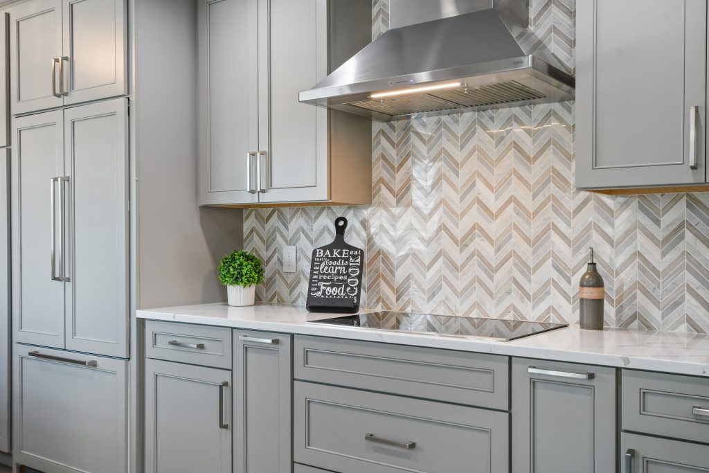 The remodeled/renovated kitchen area and herringbone backsplash.