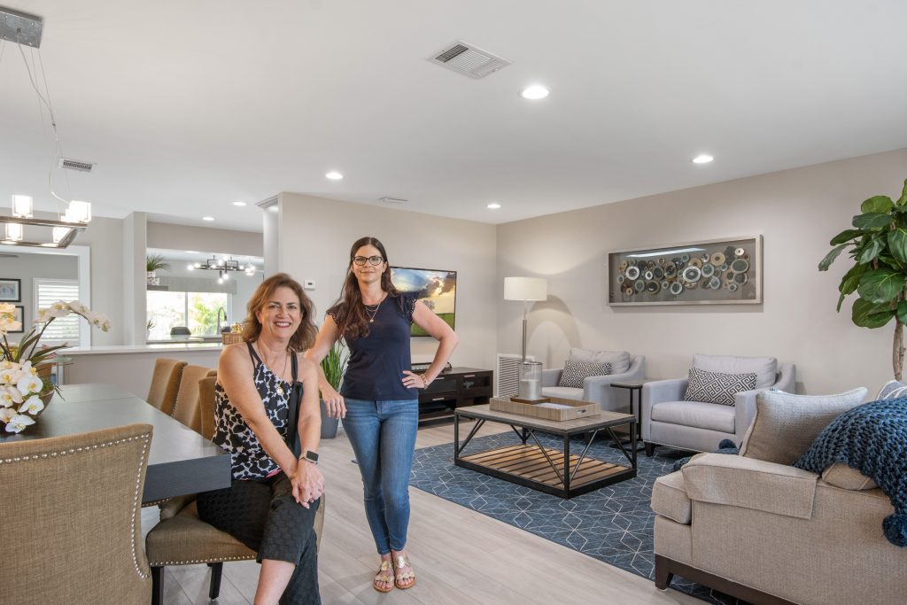 Carmen and her client in her client's Transforming Your Kitchen to be Uniquely Yours: The Art of Personalizing a Renovation

The kitchen is the heart of the family home, where meals are prepared and shared, memories are made, and connections are strengthened through the act of cooking and sharing food together. It’s also where everyone gathers during a party, so your kitchen should not only be spacious and well-organized, it should reflect your own unique personality and be a place you feel proud to entertain in. 

Here are some pictures of the kitchen before the renovation. 

Image 4335
Image 4334
Image 4336


When undergoing an open concept renovation, it’s important to select elements that flow well not just in the kitchen, but to the rest of the home as well. 

Image 4897

Caption: We selected a natural stone quartz countertop, not just for it’s beauty, but for it’s practicality as well. Kitchen cabinets in two tones–gray and moonstone, and a herringbone patterned backsplash all bring the desired look together. 

Kingston 19
Kingston 21
Kingston 18
Kingston 24


Jennifer knew immediately after buying the house that the kitchen would one day be renovated, and she knew she wanted an open concept that would flow easily for meal preparation.The new kitchen not only meets those requirements, it now shines with Jennifer’s personality and her own unique style. “It’s my favorite part of the renovation!” she says.
open-concept remodel.