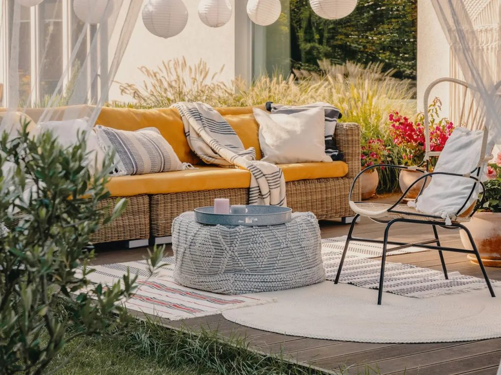 Coordinating pillows, fabrics and colors can put your outdoor patio spaces together.