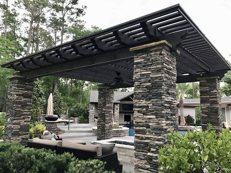 This pergola and stone structure creates the shelter and privacy desired for an intimate outdoor patio space.