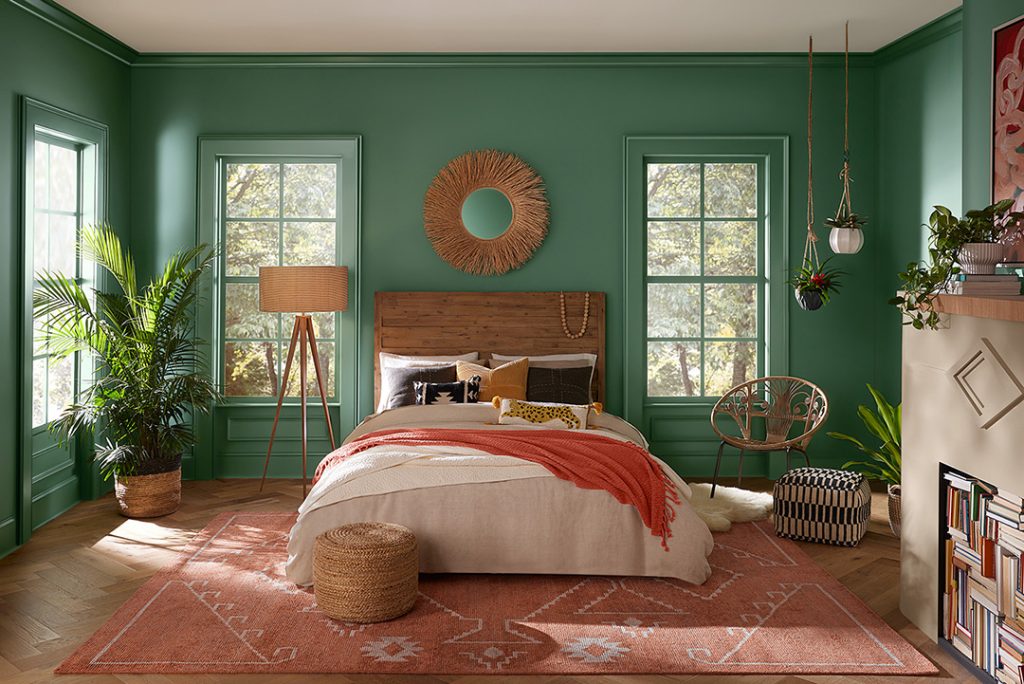 Kale Green walls add tropical flare to this bedroom.