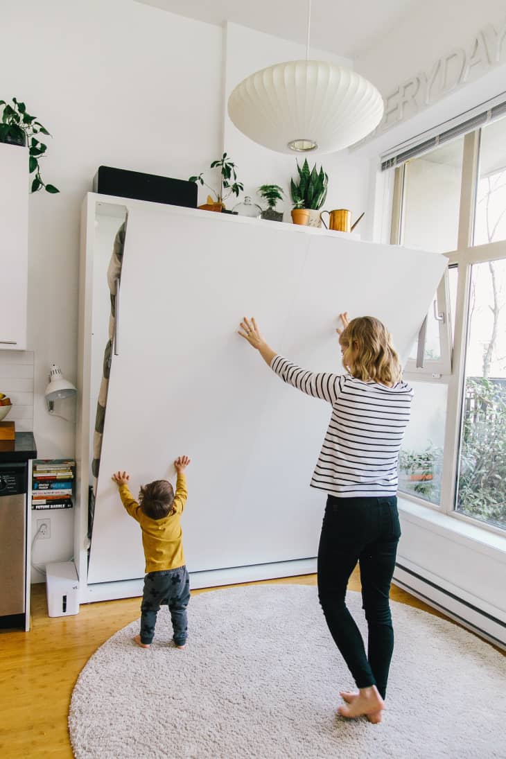 Raising and lowering a Murphy bed.