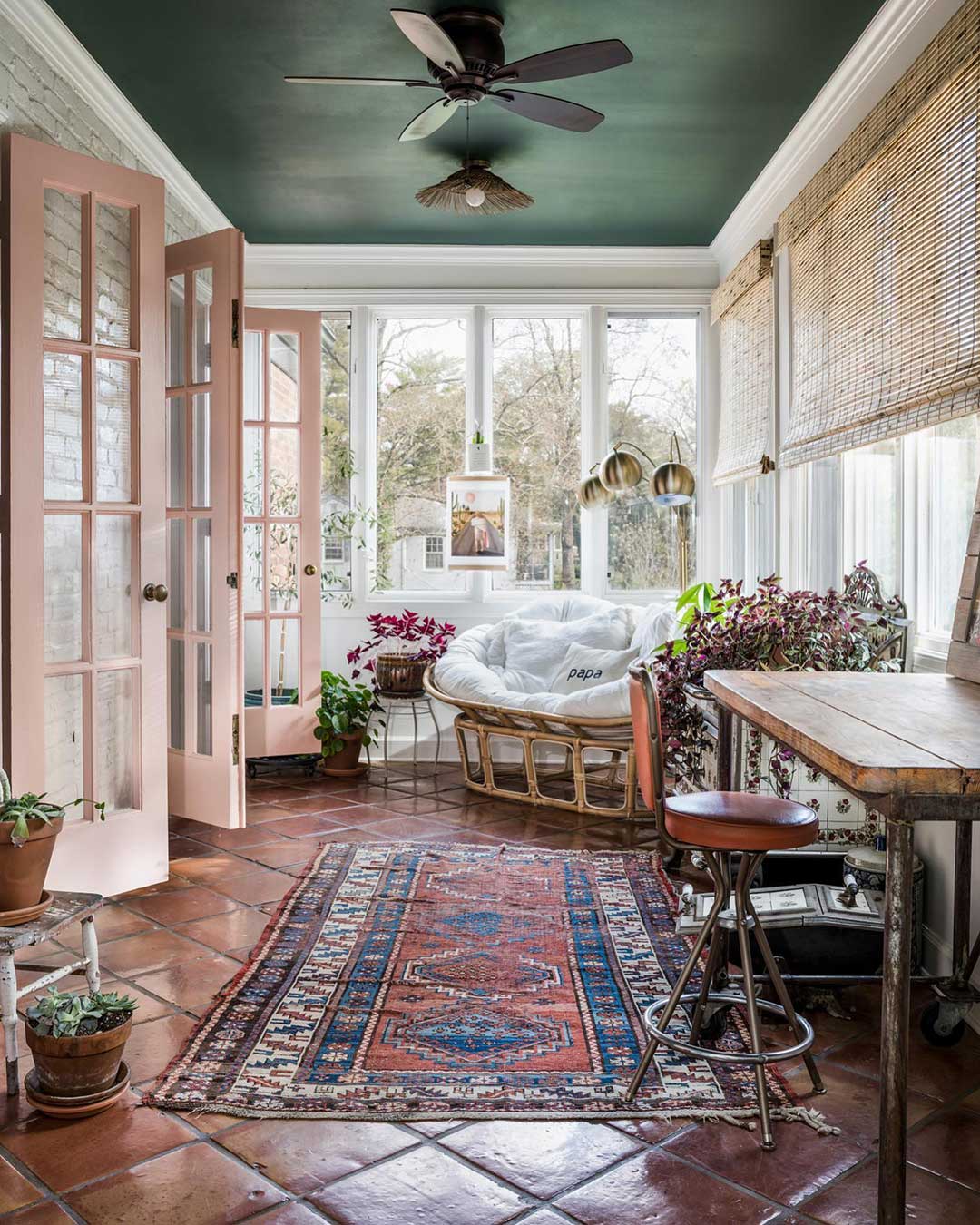 Billiard Green painted ceiling adds classic contrast to a sunroom.