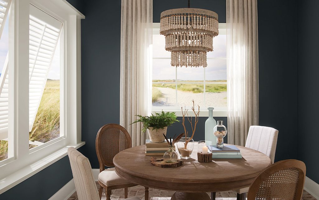 Silvermist takes a back seat to the deep, coastal navy color of Big Dipper in the dining room.