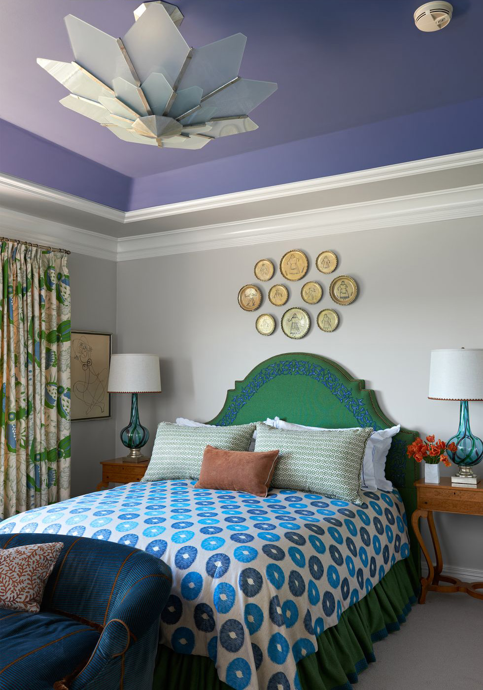 A painted ceiling enhances the mix of colors carefully chosen in this delightful bedroom.