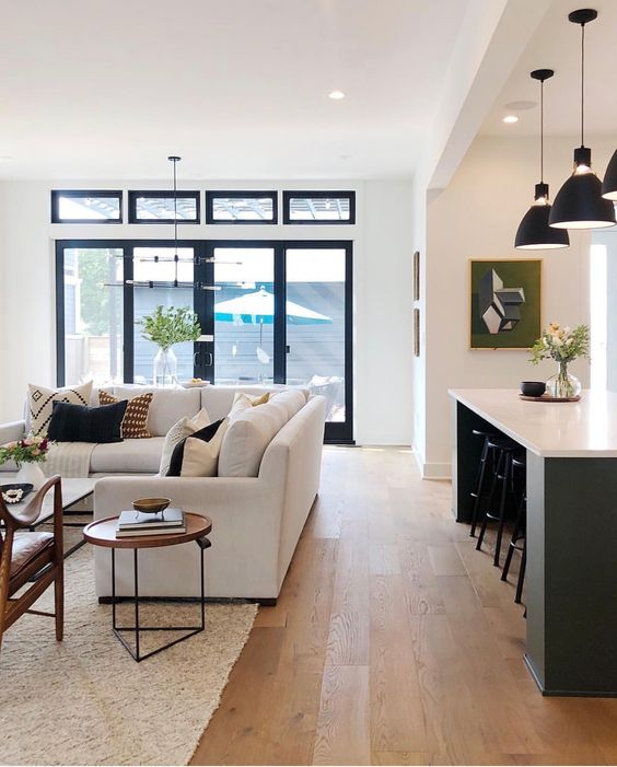If you’d like to add a bit of contrast to your spaces, think about adding a pop of black, via pendant lighting, a coffee table, lamp, side table, counter stools, or small decorative items.