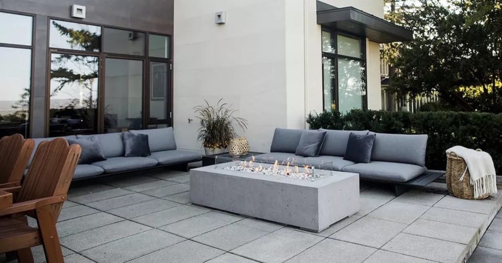 This fire table is a great centerpiece for this outdoor space.