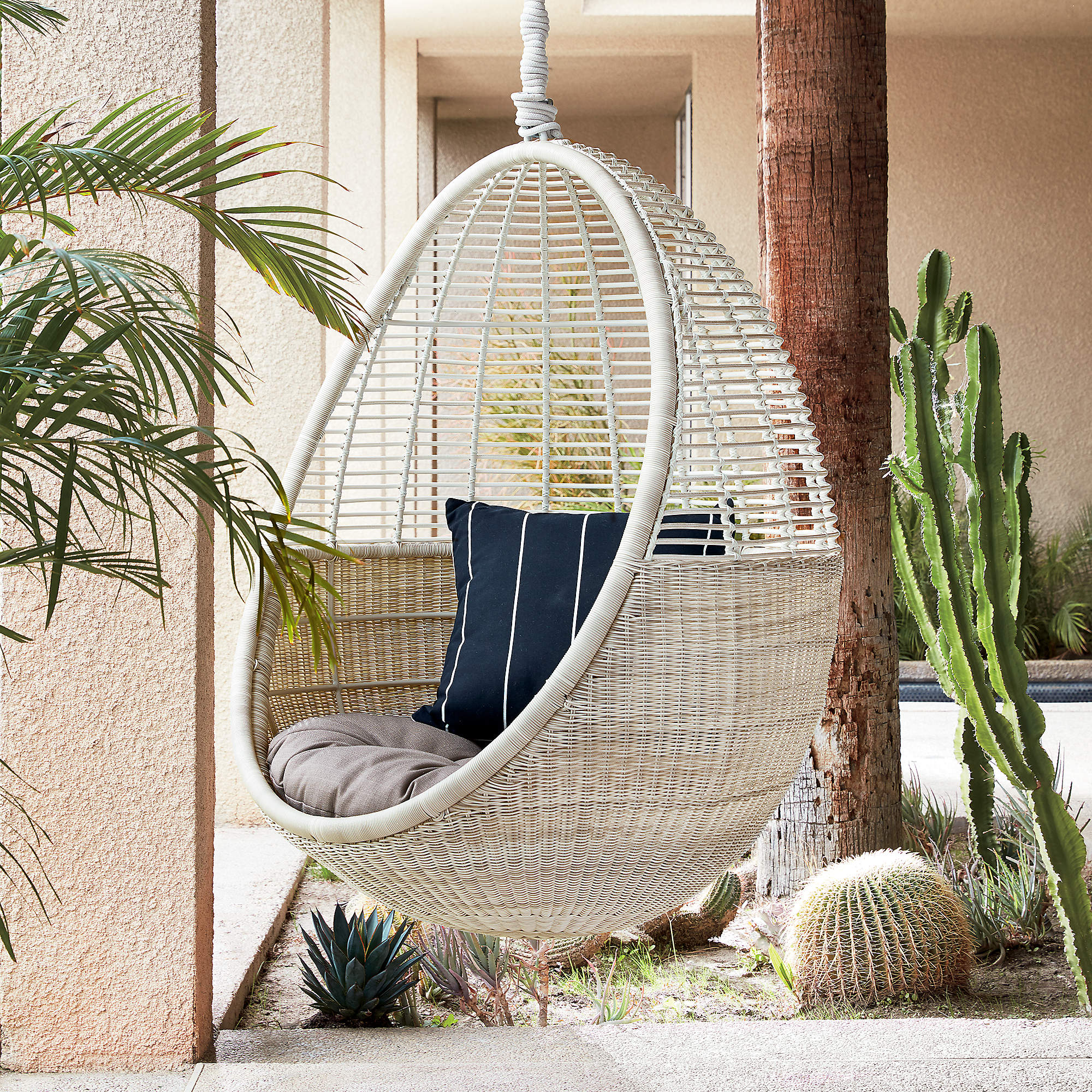 LASQLUF5XRC3HGWO6RD3Q5FE2Y Take your patio to new heights by adding a whimsical hanging chair or hammock.