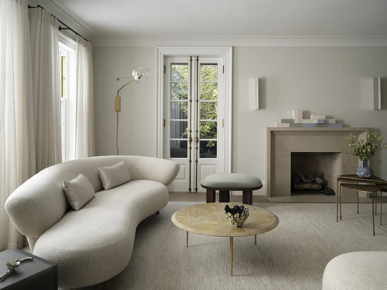 In lieu of lighting above, at the ceiling, think of having sculptural wall sconces, table and floor lamps.