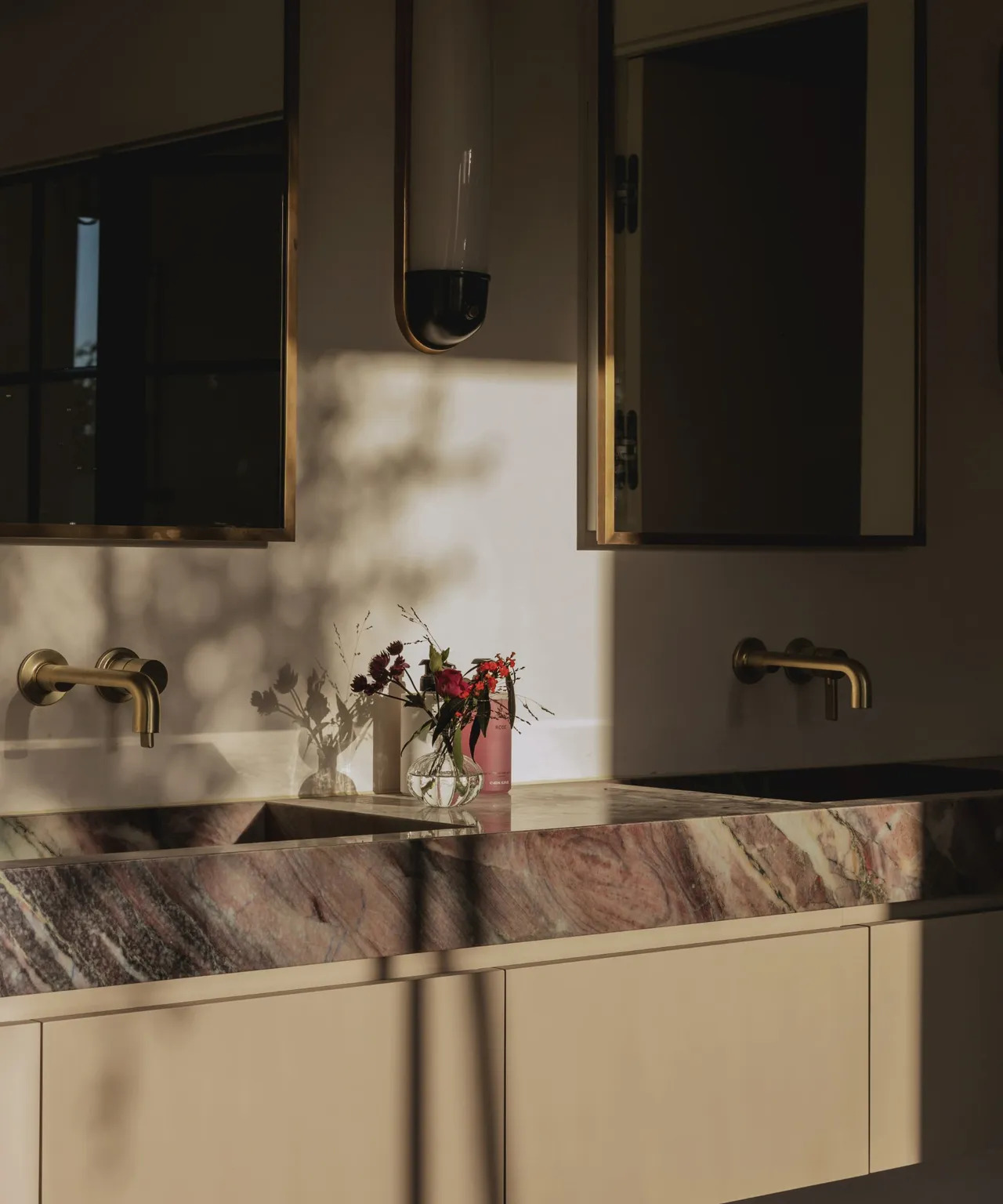 Bathrooms are somewhere you can indulge in deep, dark colors without upsetting the flow of your overall interior design.