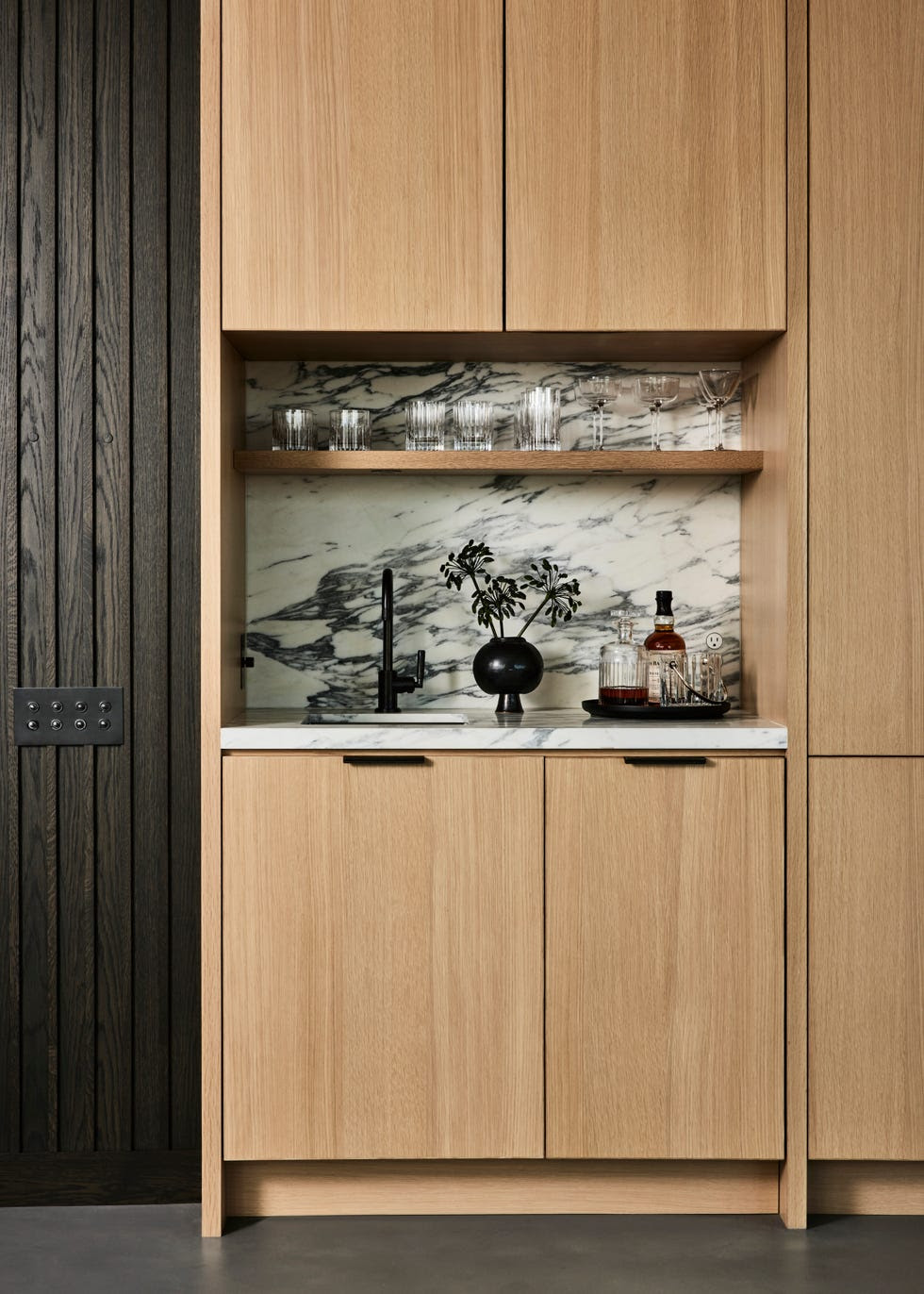 Modern materials like quartz mimic the luxe look of black-and-white marble.