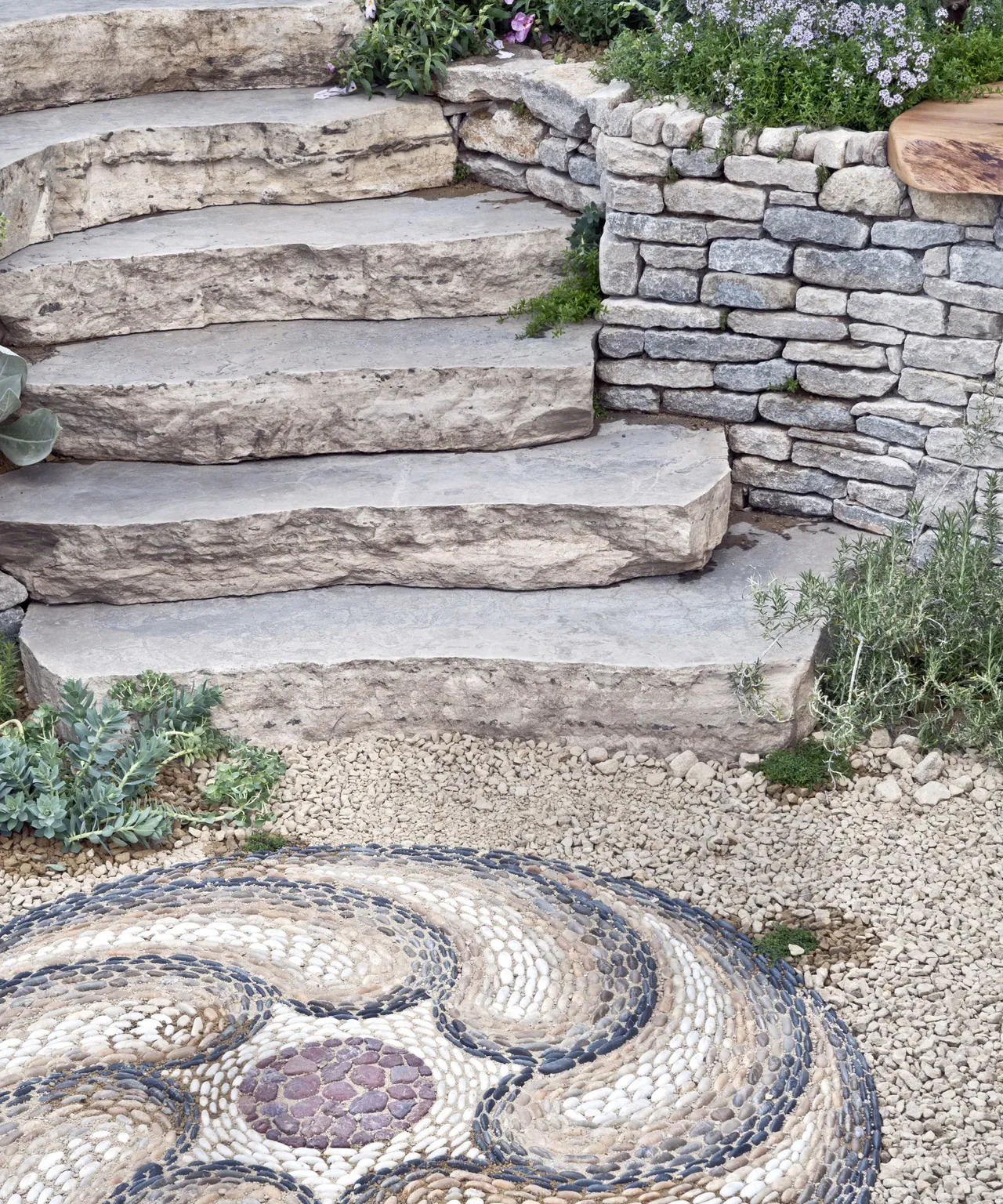 Gravel is a must for any Mediterranean-style patio, especially where foot traffic is heavy.